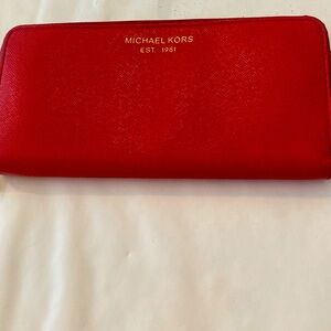 Michael Kors Red Great wallet with all the pockets inside. Purchased in AbuDhabi